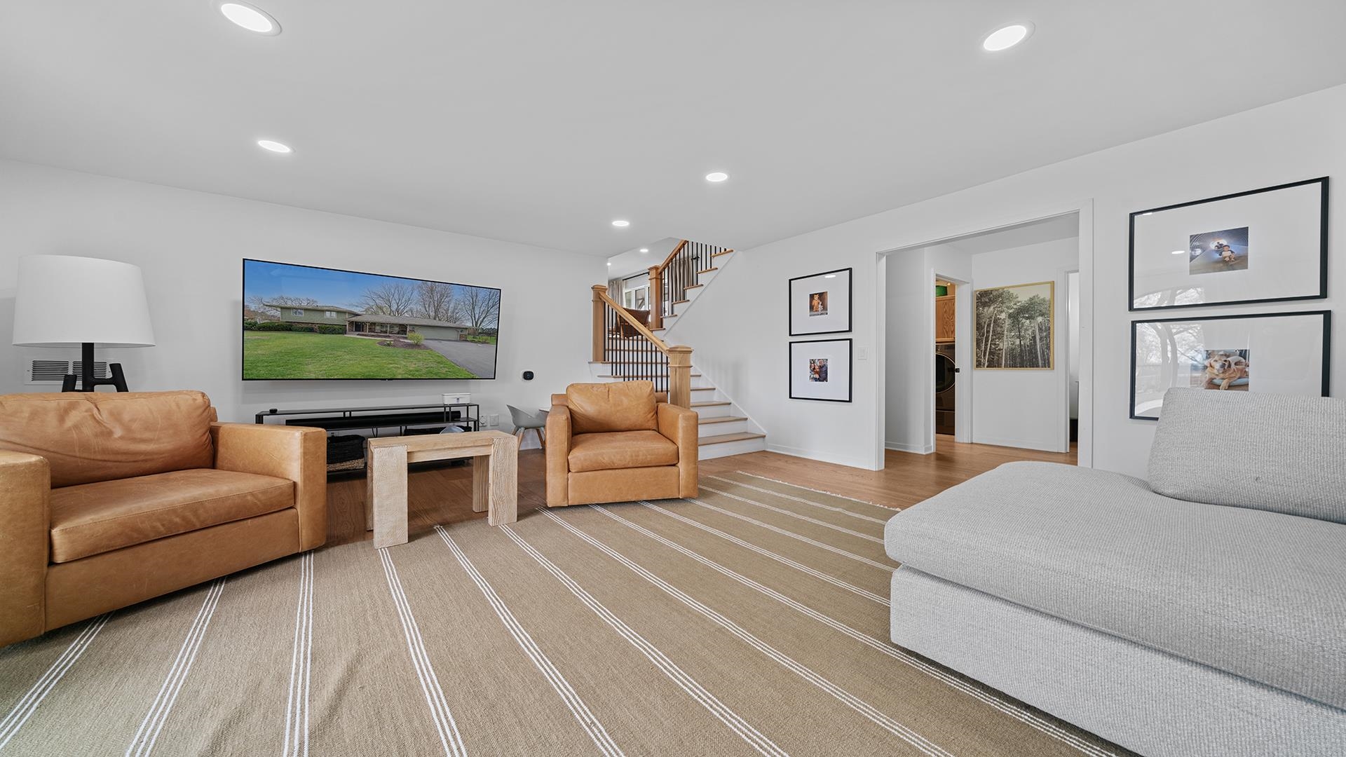 3075 East Water Road Byron, IL 61010 - Photo 29 of 46 a bedroom with furniture and a flat screen tv