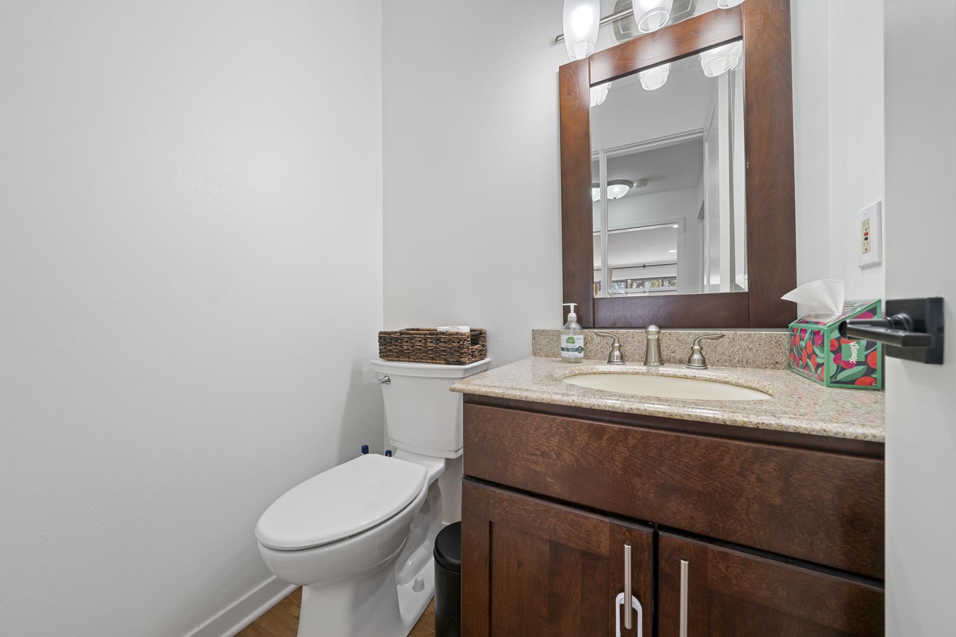 3075 East Water Road Byron, IL 61010 - Photo 32 of 46 a bathroom with a sink vanity mirror and toilet