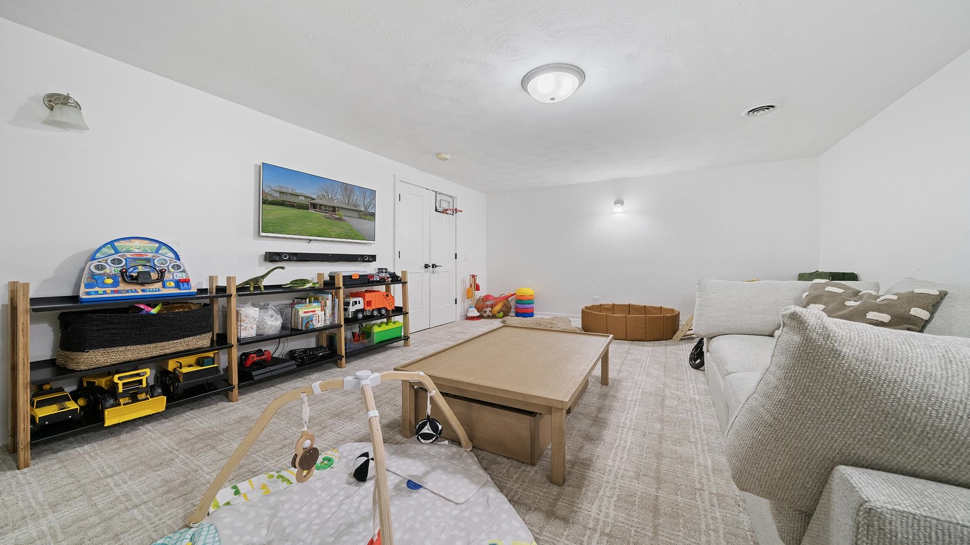 3075 East Water Road Byron, IL 61010 - Photo 34 of 46 a children room with furniture and a flat screen tv
