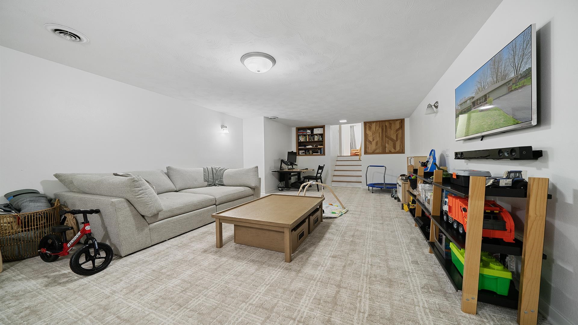 3075 East Water Road Byron, IL 61010 - Photo 35 of 46 a living room with furniture and a flat screen tv