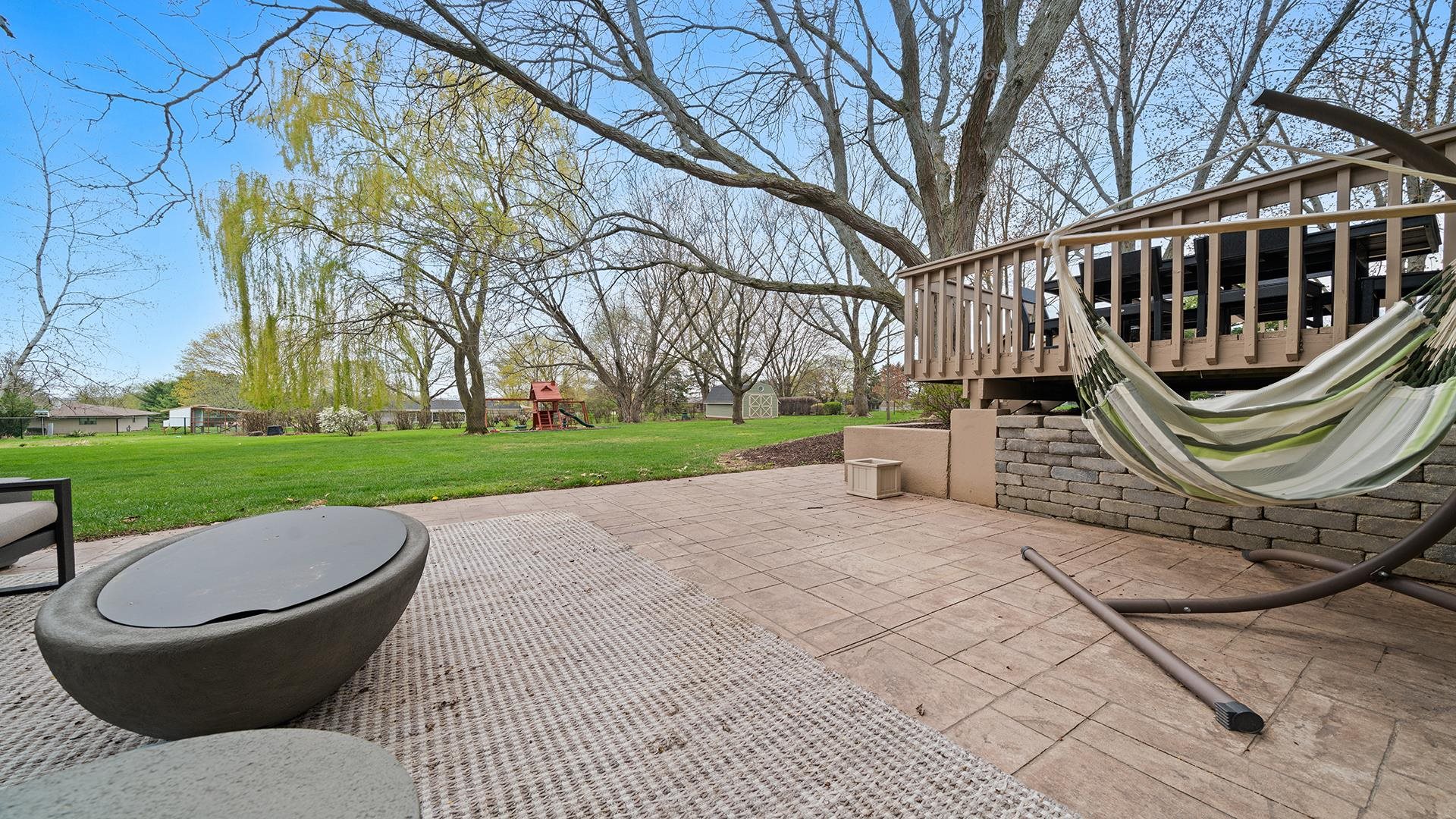 3075 East Water Road Byron, IL 61010 - Photo 39 of 46 a view of a garden with a slide