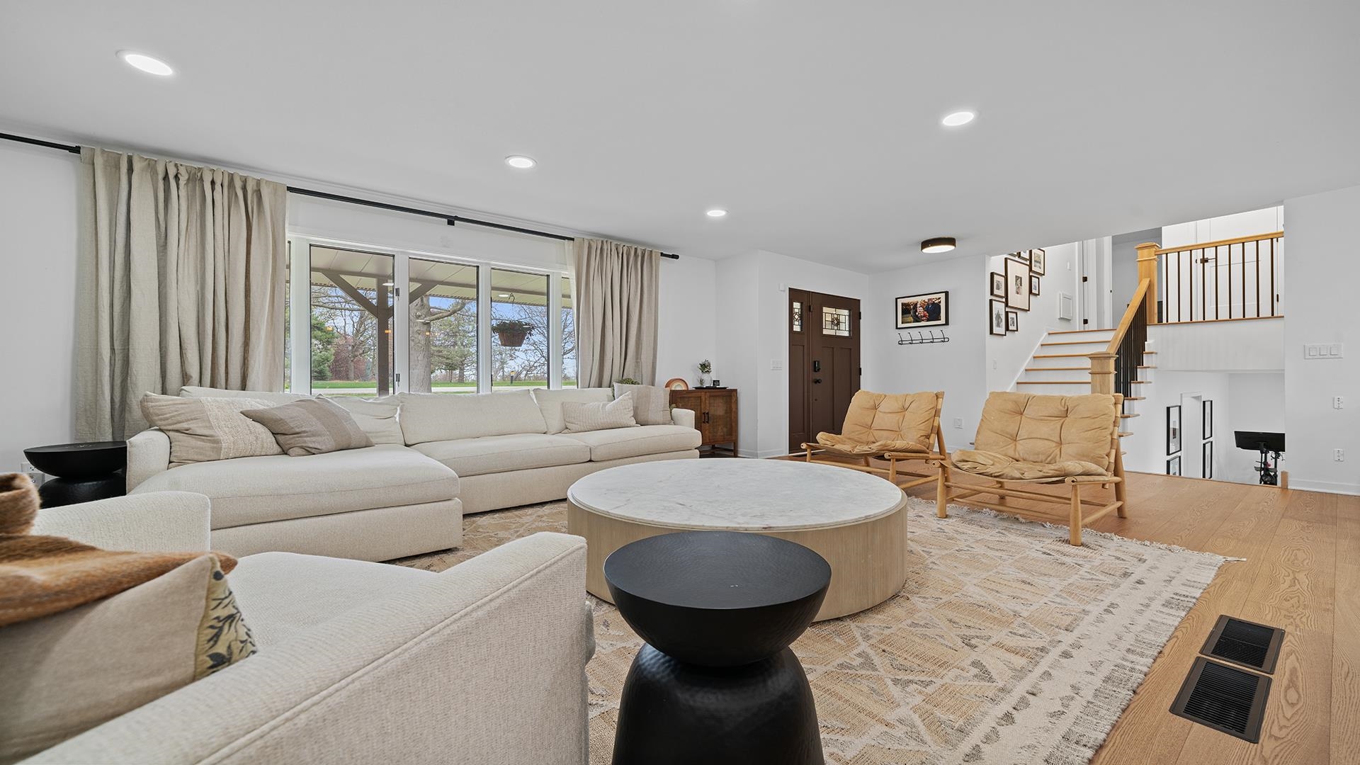 3075 East Water Road Byron, IL 61010 - Photo 4 of 46 a living room with furniture and a large window