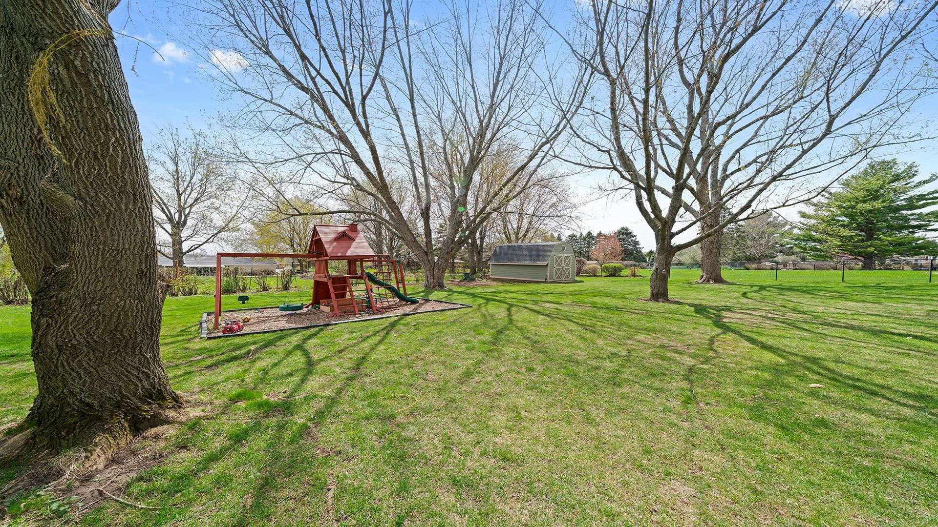 3075 East Water Road Byron, IL 61010 - Photo 42 of 46 a view of a yard with large trees
