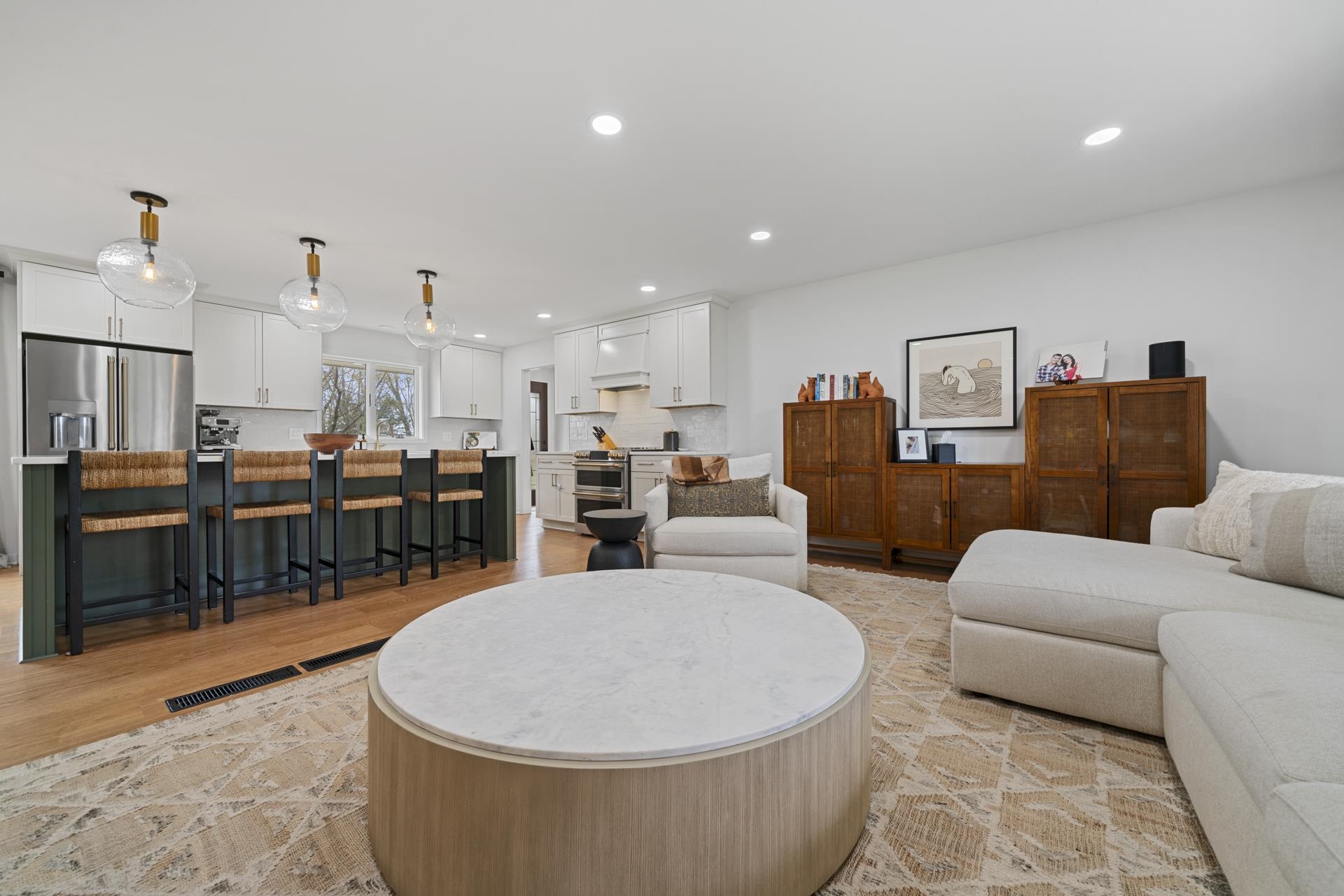 3075 East Water Road Byron, IL 61010 - Photo 8 of 46 a living room with furniture and kitchen view