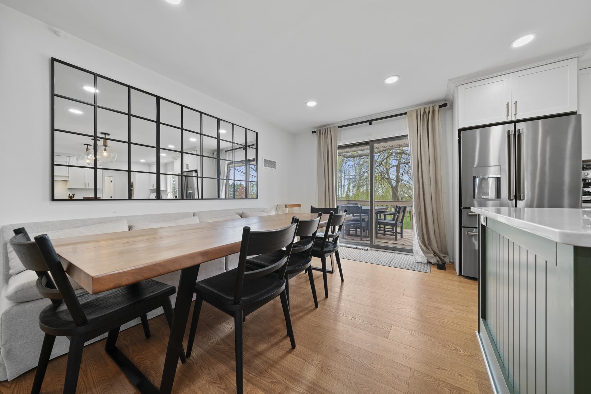 3075 East Water Road Byron, IL 61010 - Photo 9 of 46 a view of a a dining room with furniture window and wooden floor