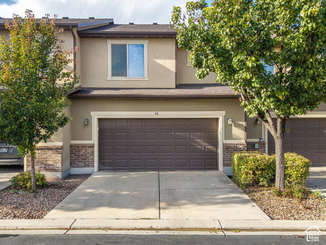 40 Ginger Gold Road Santaquin, UT 84655 - Photo 29 of 32 Two-story stucco exterior with brick detailing