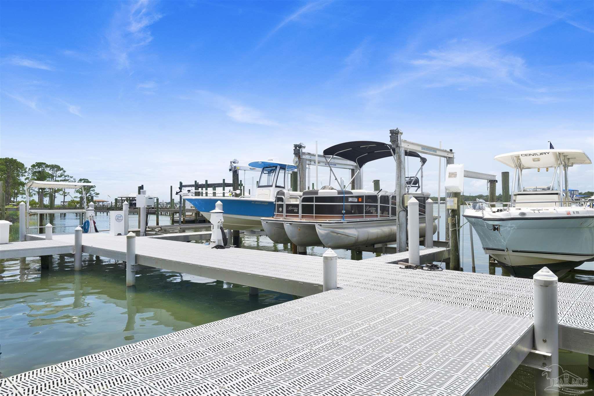 14100 River Road, Unit 334 Perdido Key, FL 32507 - Photo 2 of 35 a swimming pool with outdoor seating and yard
