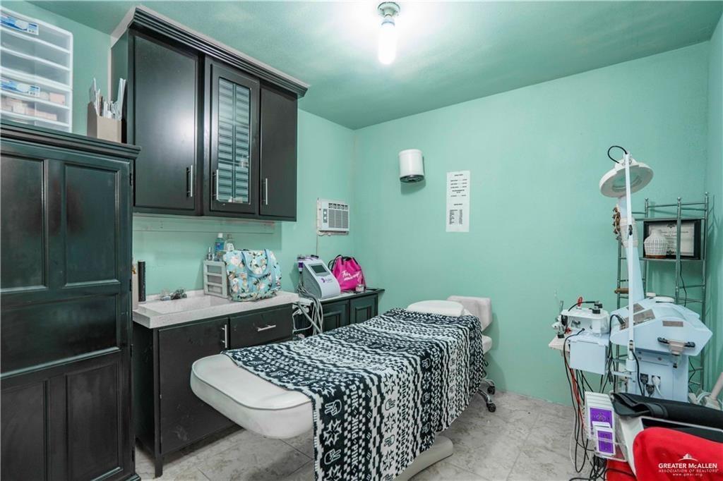 15 El Mesquite Lane Rio Grande City, TX 78582 - Photo 19 of 30 a bedroom with a bed and a dresser