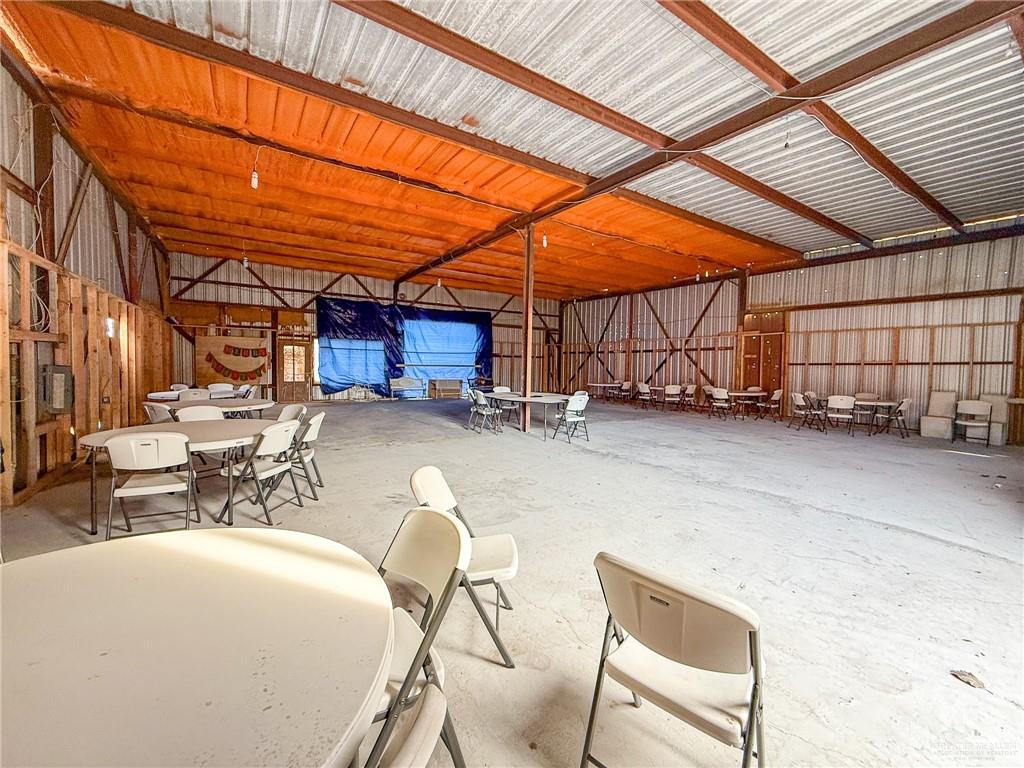 15 El Mesquite Lane Rio Grande City, TX 78582 - Photo 22 of 30 a view of a patio with table and chairs with wooden fence