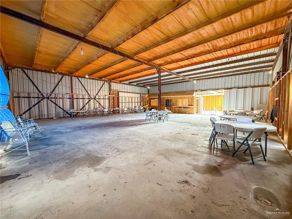 15 El Mesquite Lane Rio Grande City, TX 78582 - Photo 23 of 30 a view of a patio with table and chairs with wooden floor