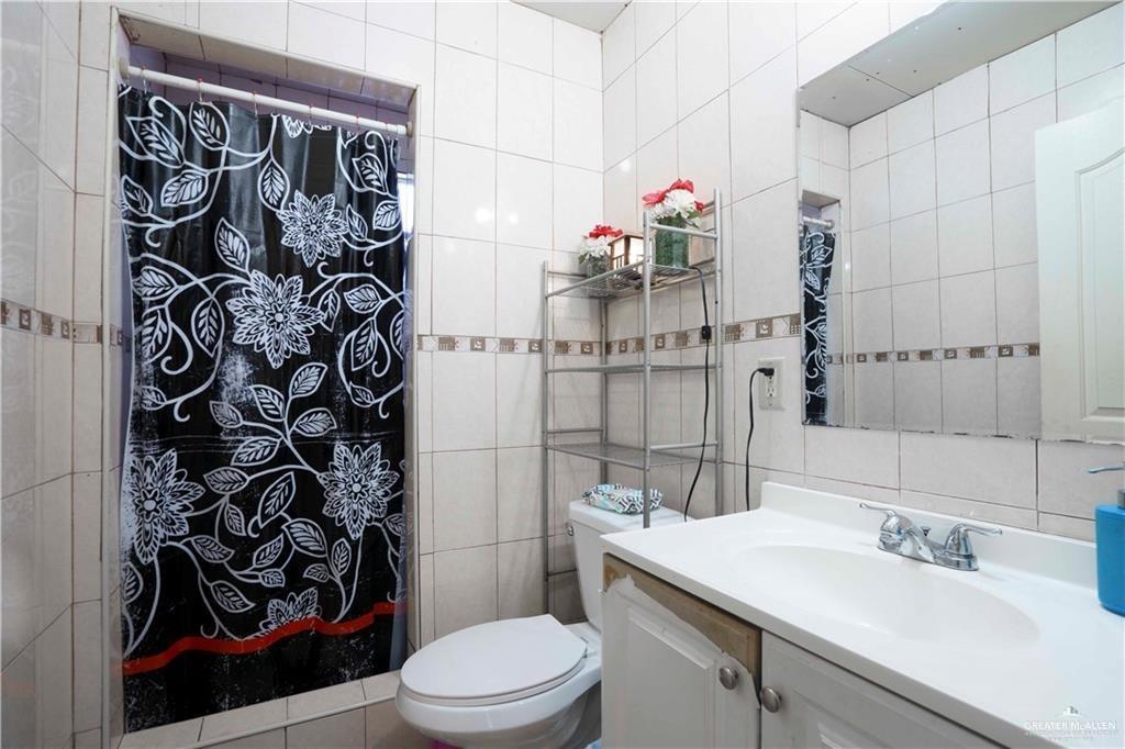 15 El Mesquite Lane Rio Grande City, TX 78582 - Photo 9 of 30 a bathroom with a sink toilet and shower
