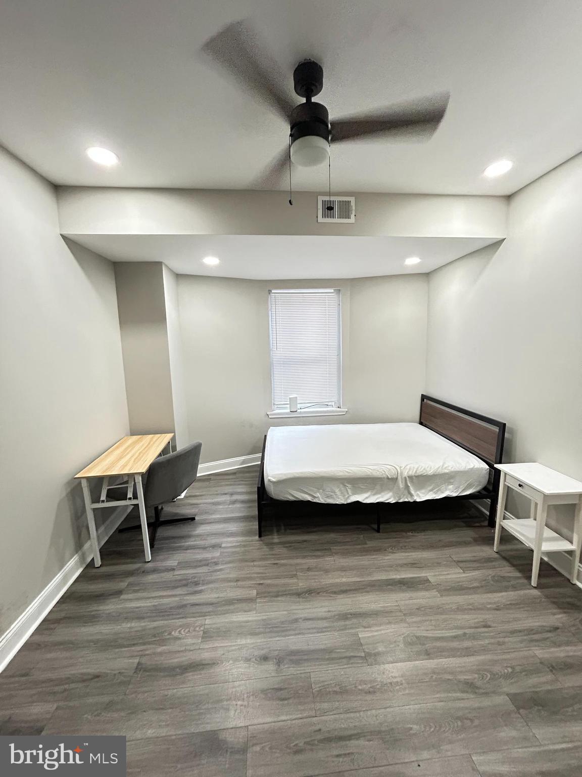 2417 North 54th Street, Unit A Philadelphia, PA 19131 - Photo 11 of 13 a bedroom with a bed and a chair