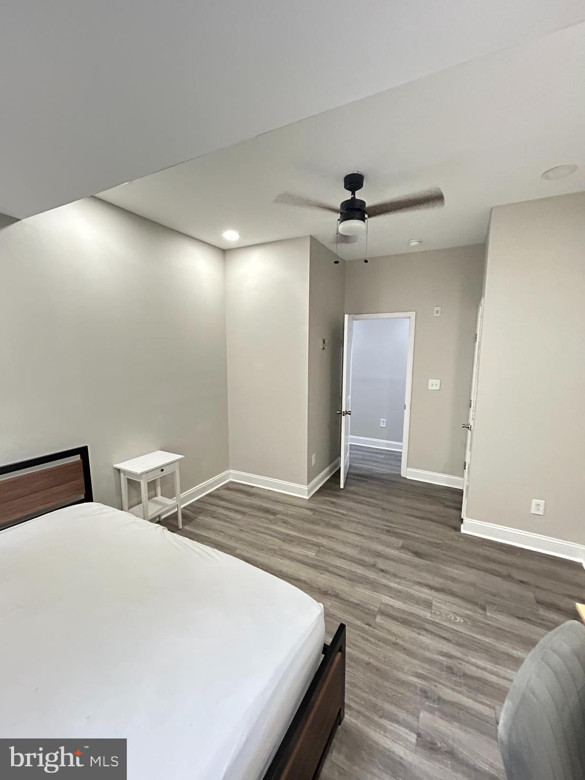 2417 North 54th Street, Unit A Philadelphia, PA 19131 - Photo 12 of 13 a spacious bedroom with a bed and a ceiling fan