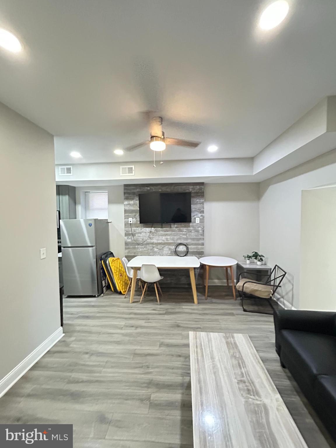 2417 North 54th Street, Unit A Philadelphia, PA 19131 - Photo 5 of 13 a living room with furniture and a flat screen tv