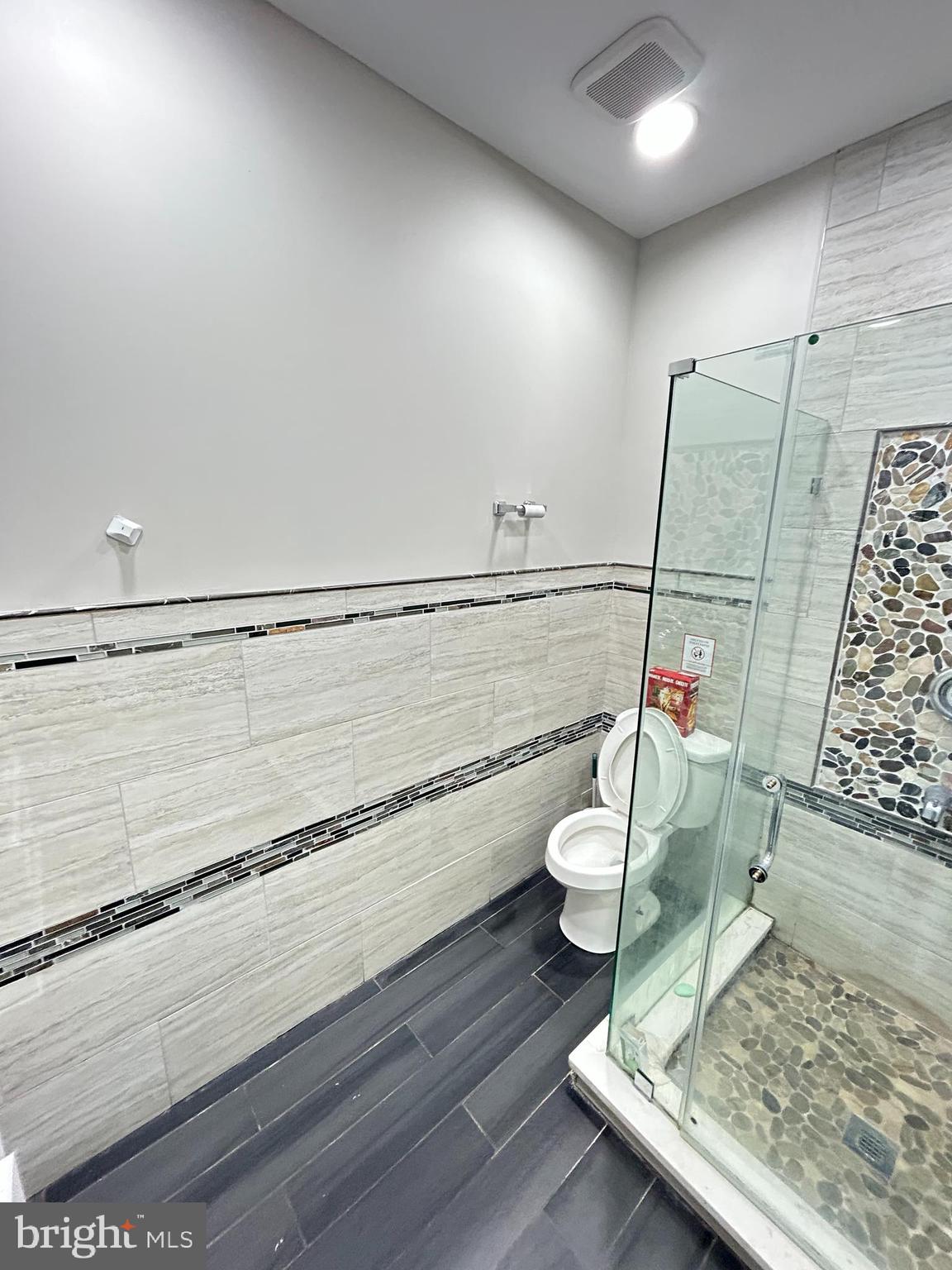 2417 North 54th Street, Unit A Philadelphia, PA 19131 - Photo 8 of 13 a living room with a rug