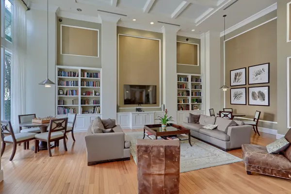 a living room with furniture and wooden floor