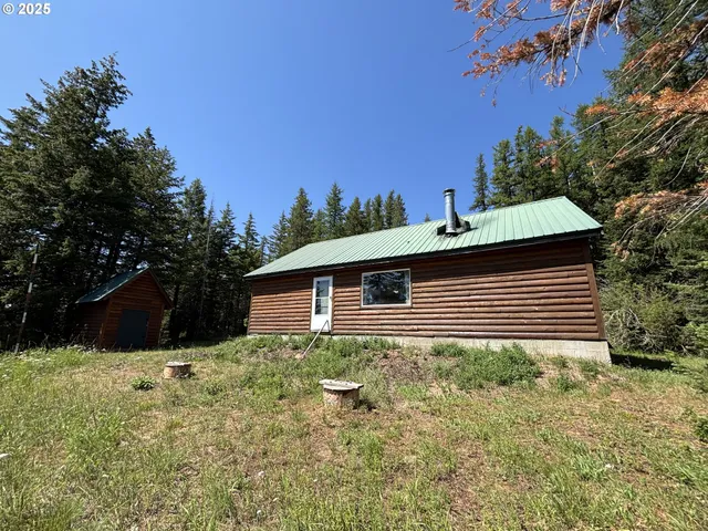a backyard of a house with lots of green space