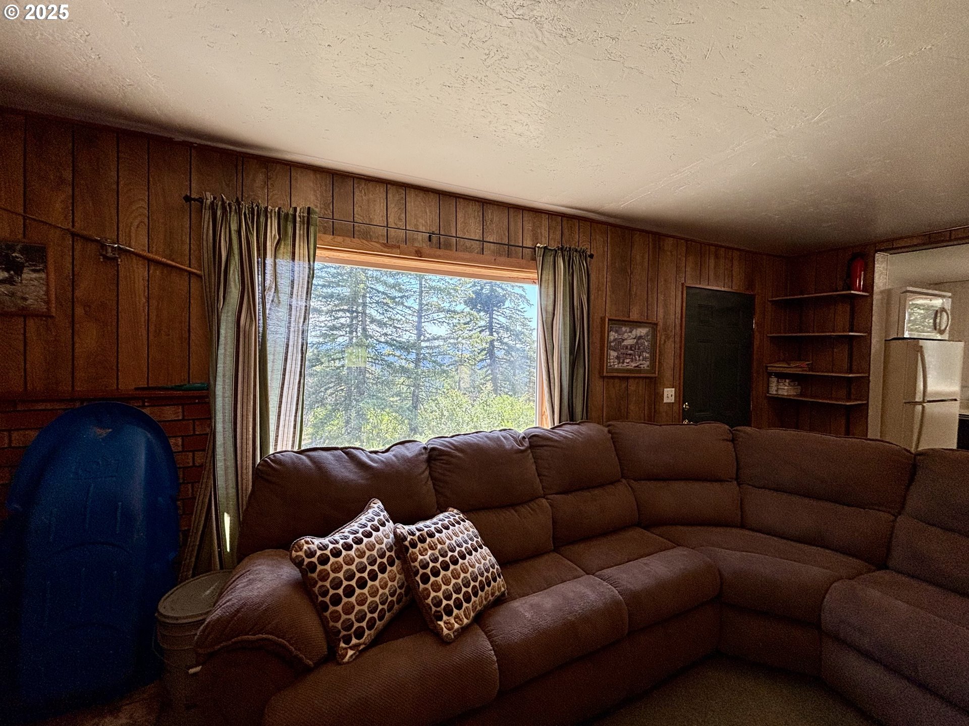 78248 McIntyre Road Weston, OR 97886 - Photo 6 of 19 a living room with furniture and a large window
