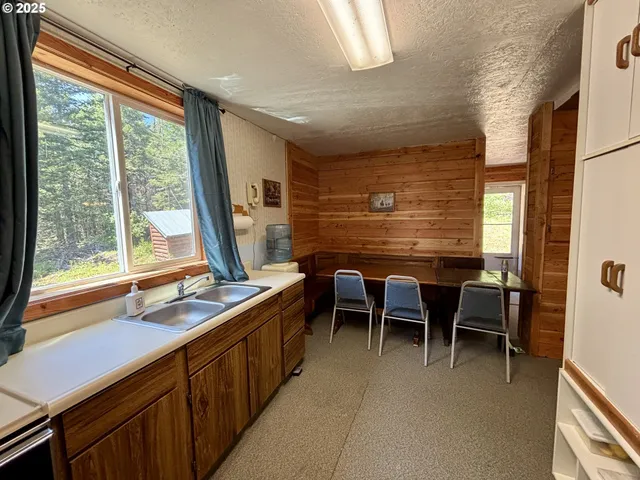 a dining room with furniture and windows