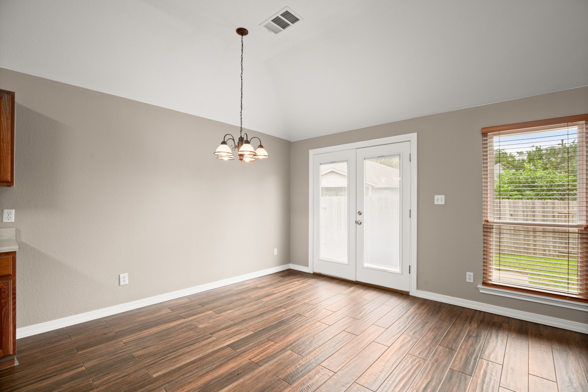3420 Ribbon Reef Lane Austin, TX 78728 - Photo 8 of 25 Breakfast area with French doors to patio
