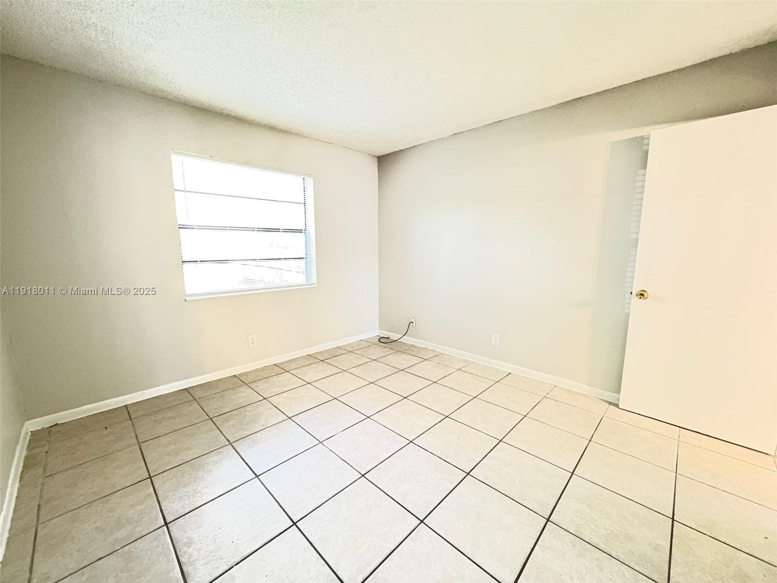 4022 Lakeside Drive, Unit 4022 Tamarac, FL 33319 - Photo 4 of 13 a view of a room with a window