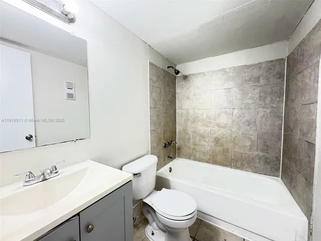 a bathroom with a sink a toilet and a bathtub