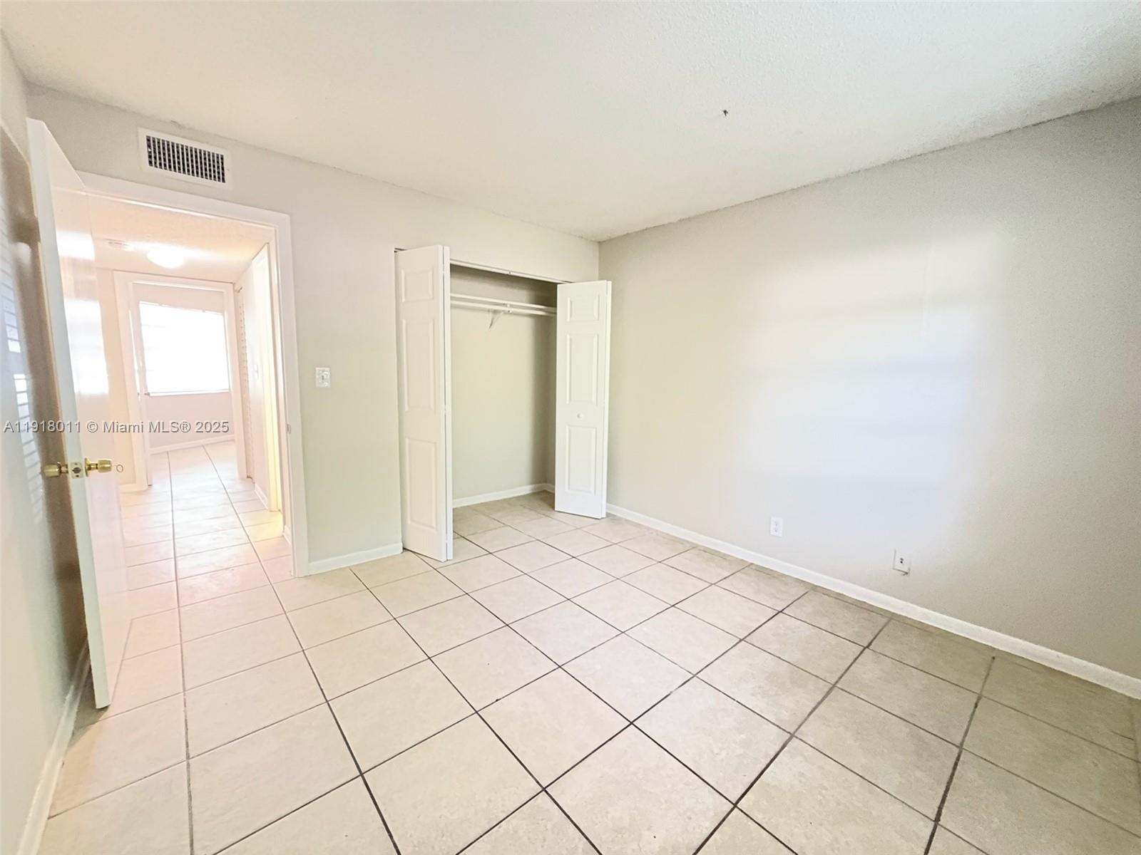 4022 Lakeside Drive, Unit 4022 Tamarac, FL 33319 - Photo 10 of 13 a view of an empty room and window