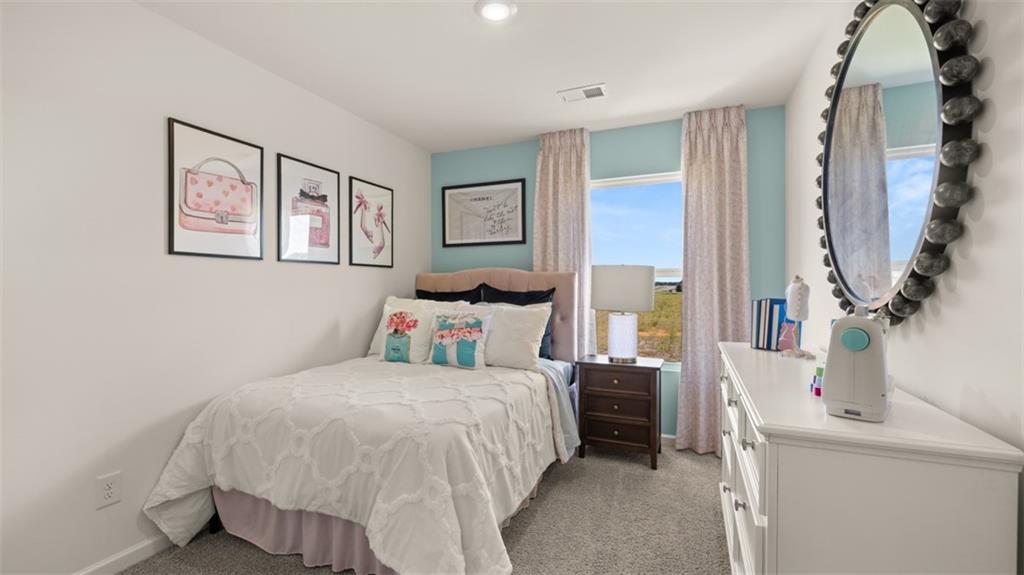 200 Kenmore Circle Perry, GA 31069 - Photo 38 of 47 a bedroom with a bed and a painting on the wall