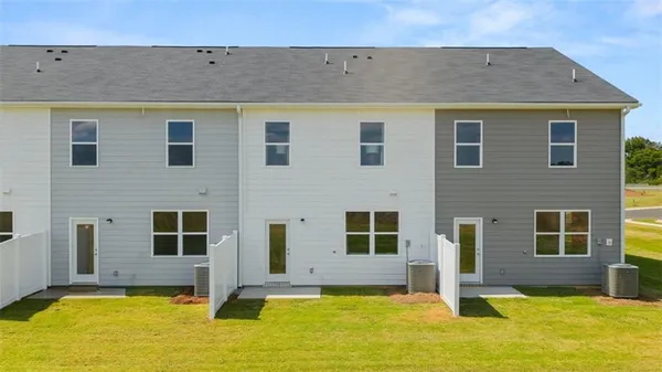 a view of house with yard