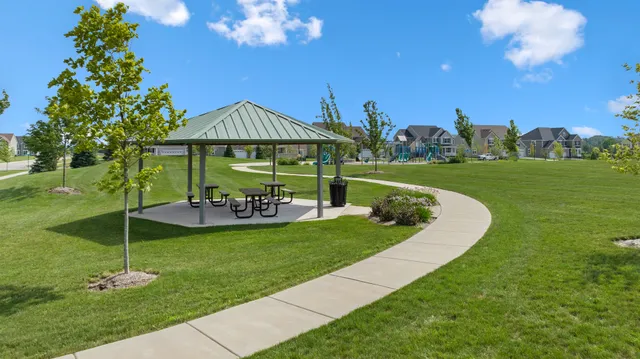 a view of a park with swings and slides