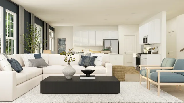 a living room with furniture and large windows