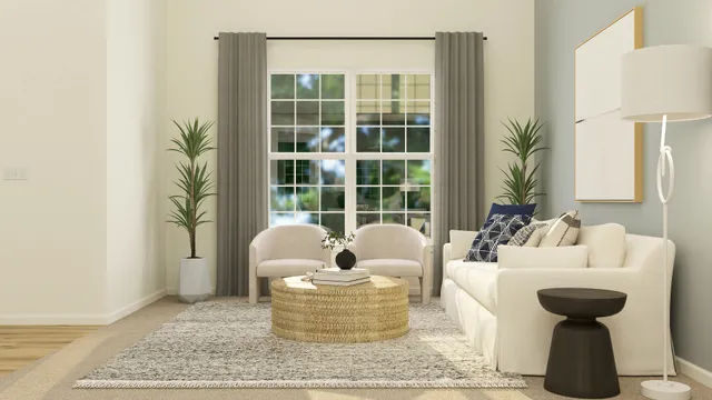 a living room with furniture and a potted plant