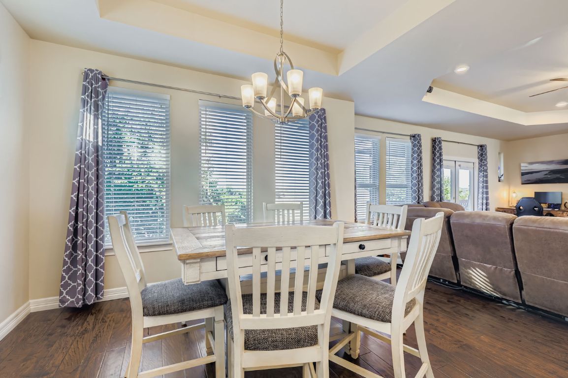 19004 Mariners Point Lago Vista, TX 78645 - Photo 12 of 23 a view of a dining room with furniture window and wooden floor