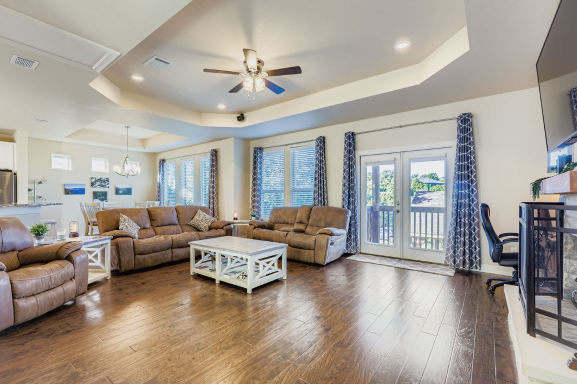 19004 Mariners Point Lago Vista, TX 78645 - Photo 13 of 23 a living room with furniture and a large window