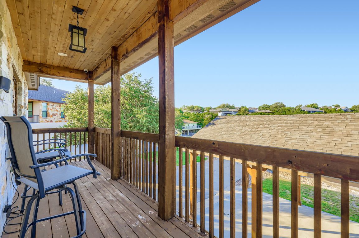 19004 Mariners Point Lago Vista, TX 78645 - Photo 16 of 23 a view of a balcony with wooden floor and iron stairs