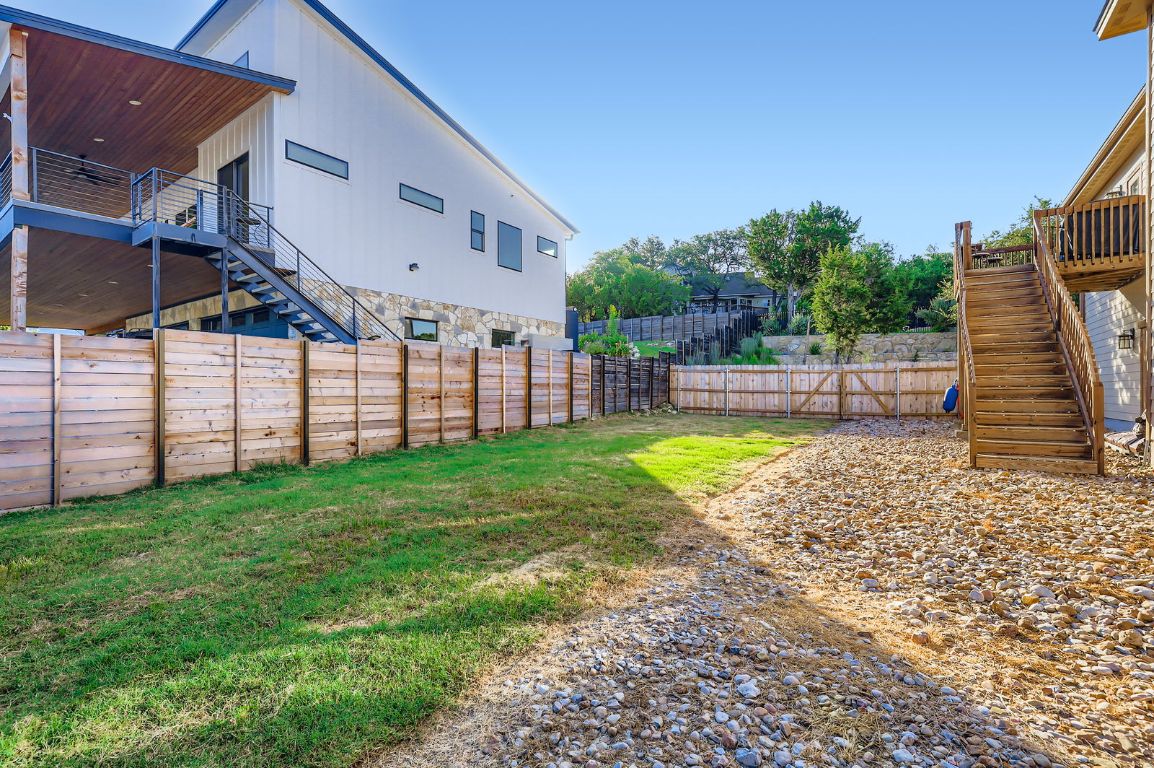 19004 Mariners Point Lago Vista, TX 78645 - Photo 18 of 23 a view of a backyard with a garden