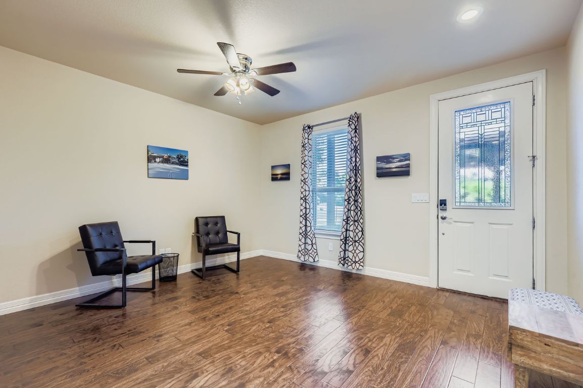 19004 Mariners Point Lago Vista, TX 78645 - Photo 4 of 23 a living room with furniture and a wooden floor