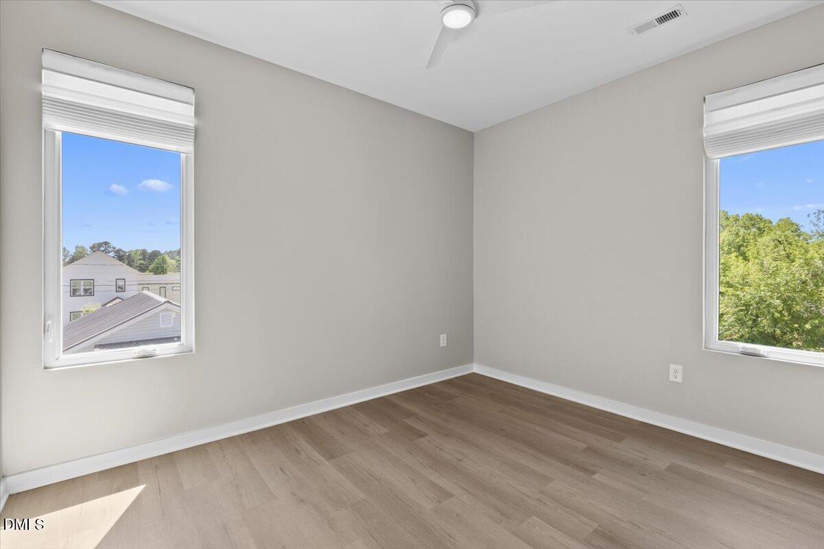 412 Commonwealth Street Durham, NC 27703 - Photo 13 of 24 an empty room with a window