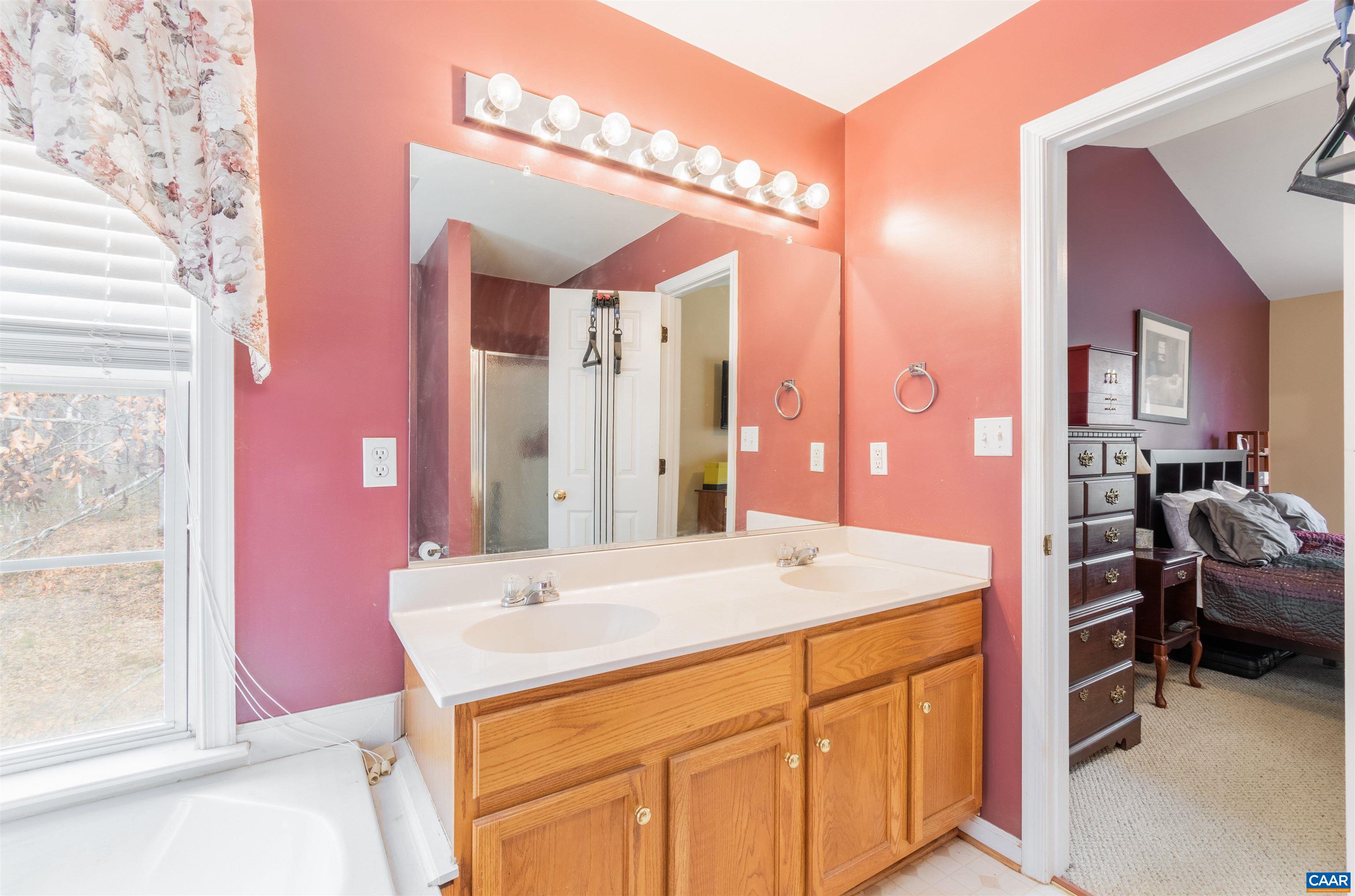 46 Lilac Road Ruckersville, VA 22968 - Photo 18 of 26 a bathroom with a sink a vanity and a mirror