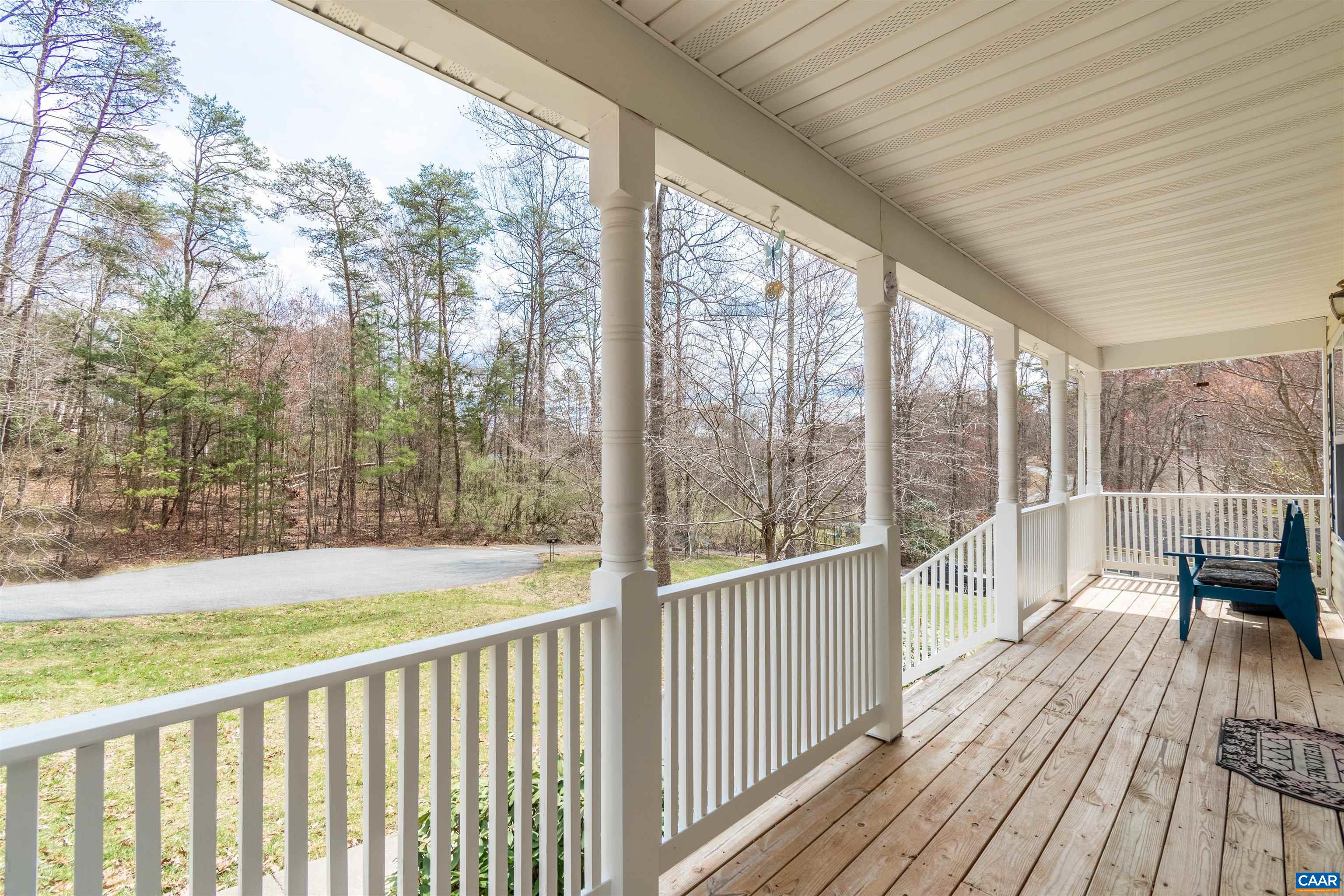46 Lilac Road Ruckersville, VA 22968 - Photo 2 of 26 a view of a wooden deck with a yard