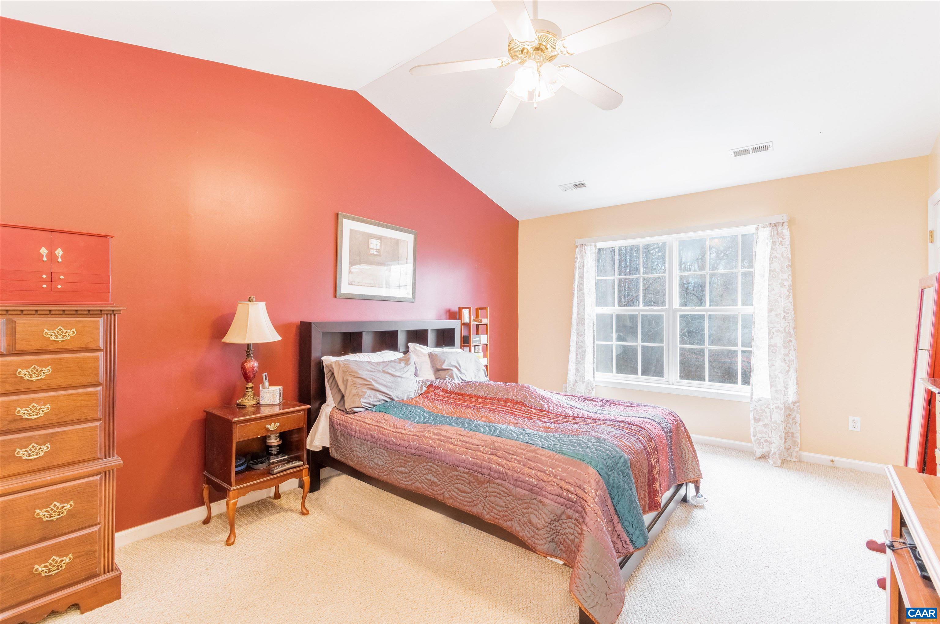 46 Lilac Road Ruckersville, VA 22968 - Photo 4 of 26 a bedroom with a bed a desk and chair with window