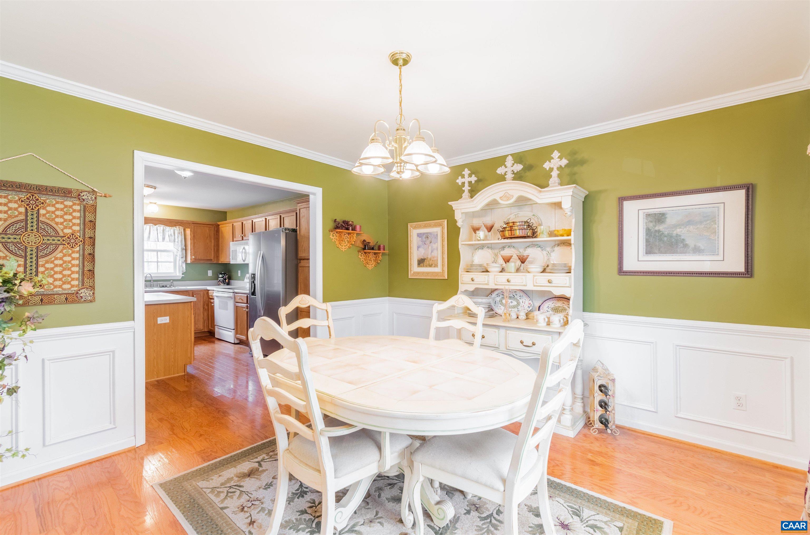 46 Lilac Road Ruckersville, VA 22968 - Photo 9 of 26 a view of a dining room with furniture wooden floor and a chandelier