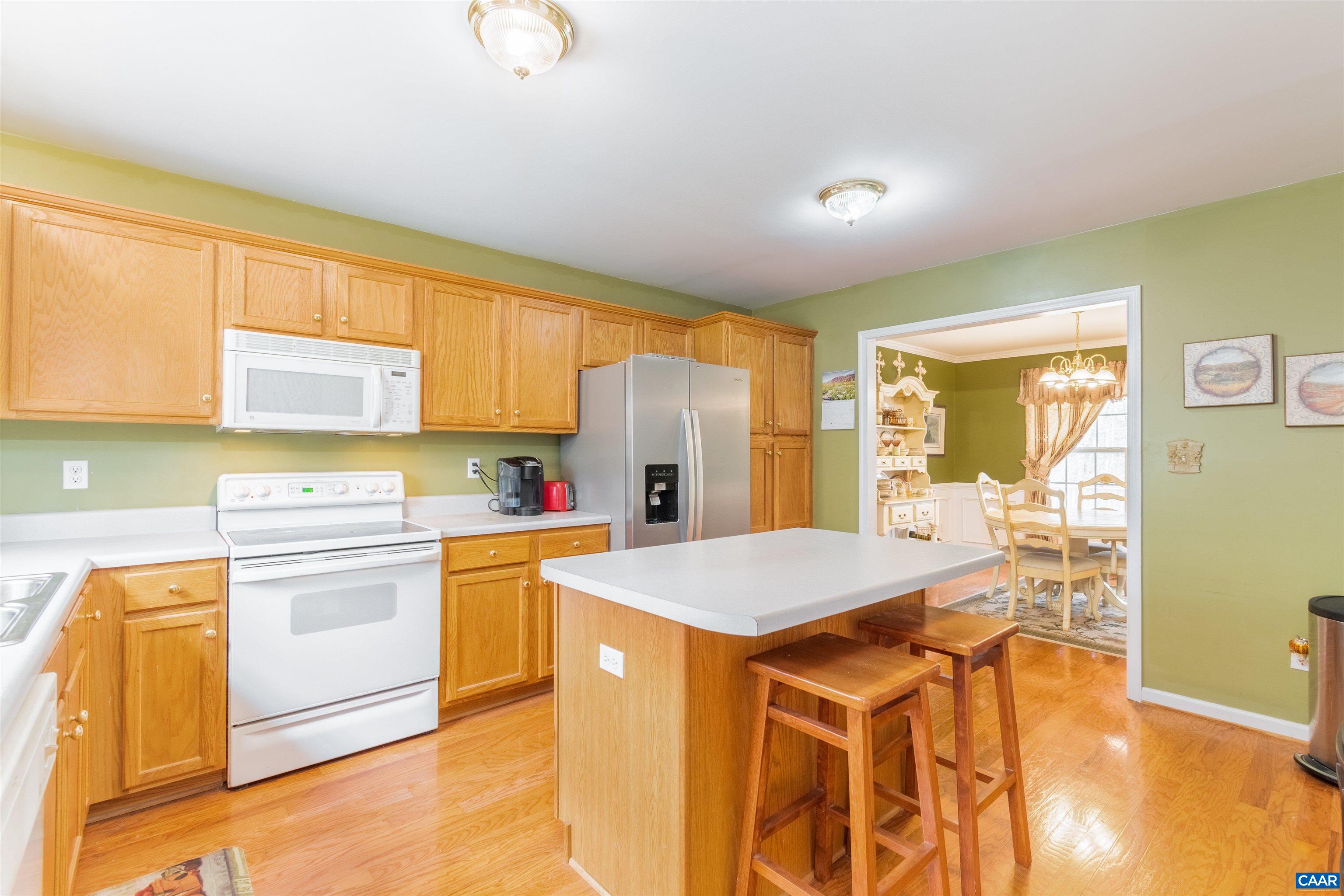 46 Lilac Road Ruckersville, VA 22968 - Photo 10 of 26 a kitchen with a stove a refrigerator and a sink