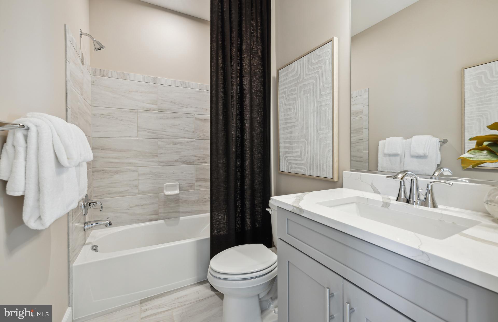 14495 Leafhopper Drive Boyds, MD 20841 - Photo 14 of 37 a bathroom with a sink toilet and shower