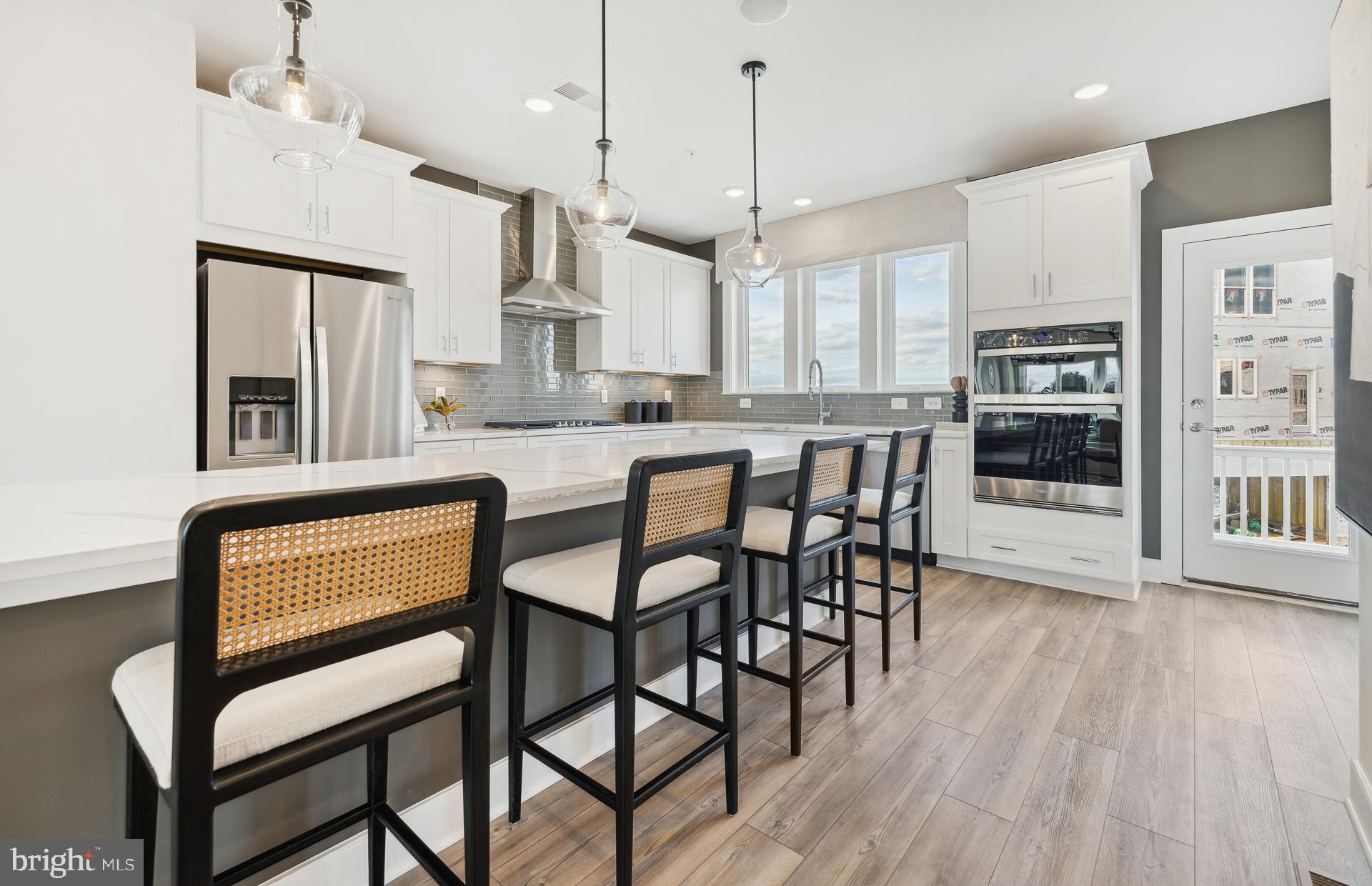 14495 Leafhopper Drive Boyds, MD 20841 - Photo 2 of 37 a kitchen with stainless steel appliances granite countertop wooden floor window and cabinets