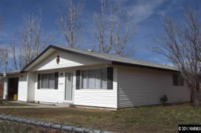 a front view of a house with a garage
