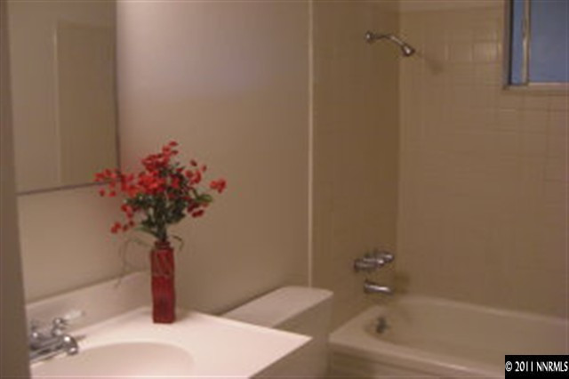 9415 Fremont Way Reno, NV 89506 - Photo 5 of 13 a bath room with a bathtub and a shower