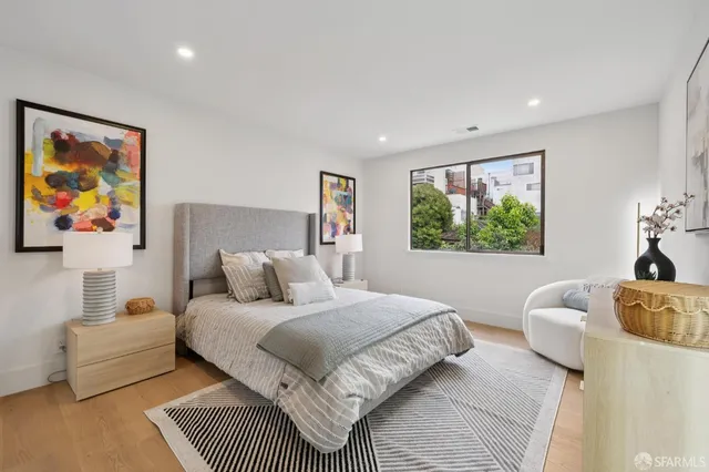 a bedroom with a bed and a couch