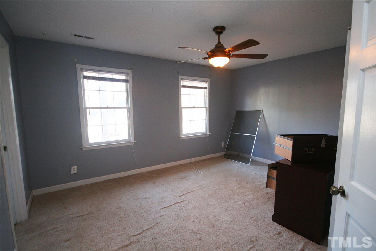 5821 Morning Forest Drive Raleigh, NC 27609 - Photo 14 of 25 a livingroom with window and ceiling fan
