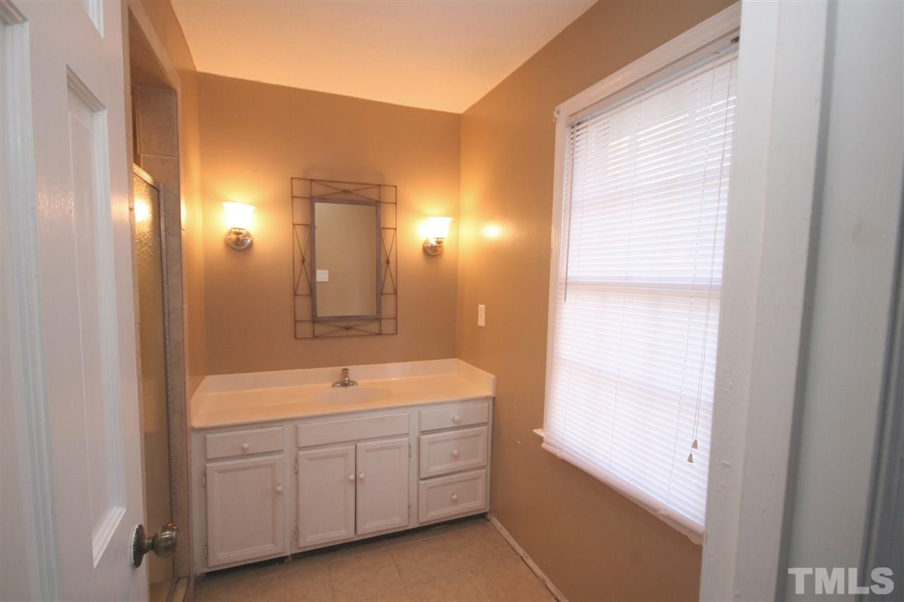 5821 Morning Forest Drive Raleigh, NC 27609 - Photo 15 of 25 a spacious bathroom with a double vanity sink and a mirror